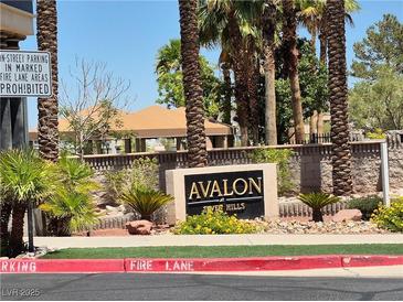 Avalon at Seven Hills community sign with desert landscaping and parking restrictions posted at 2900 Sunridge Heights Pkwy # 418, Henderson, NV 89052