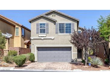 Charming two-story home featuring a gray color palette and a two-car garage at 7720 Houston Peak St, Las Vegas, NV 89166
