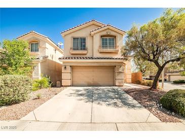 Charming two-story home featuring a two-car garage and well-maintained front yard in a residential neighborhood at 9122 Mountain Maple Ct, Las Vegas, NV 89148