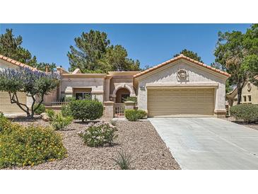Charming single-story home with desert landscaping and a two-car garage at 9516 City Hill Ct, Las Vegas, NV 89134