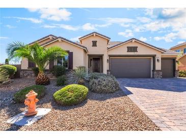 Charming single-story home with well-manicured landscaping, desert plants and a two-car garage at 5601 Mackenzie Park Ct, Las Vegas, NV 89130