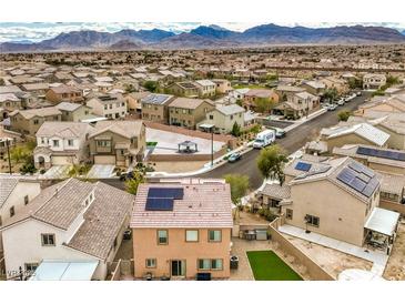 An aerial view of a residential neighborhood with houses and mountains in the background at 7948 Eastern Elk St, Las Vegas, NV 89149