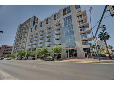 Contemporary high-rise condo building featuring balconies and expansive windows offers an upscale urban living experience at 353 E Bonneville Ave # 313, Las Vegas, NV 89101