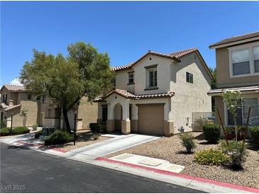 Charming two-story home featuring an attached garage and well-maintained landscaping at 7226 Freedom Ring St, Las Vegas, NV 89148