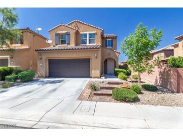 Charming two-story home featuring a desert landscape, a driveway, and a two car garage at 7652 Silver Baron Rd, Las Vegas, NV 89179