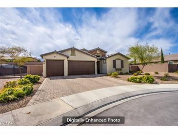 Charming single-story home featuring a three-car garage and a well-maintained brick driveway at 10470 Irish Cliffs Ct, Las Vegas, NV 89149
