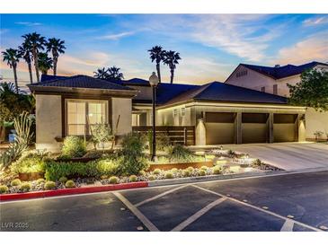 Beautiful exterior showcasing a three-car garage and desert landscaping at 1509 Winslow St, Las Vegas, NV 89117