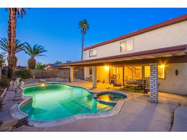 Backyard pool and hot tub with covered patio, perfect for outdoor entertaining in a great residential neighborhood at 4539 Peardale Dr, Las Vegas, NV 89147
