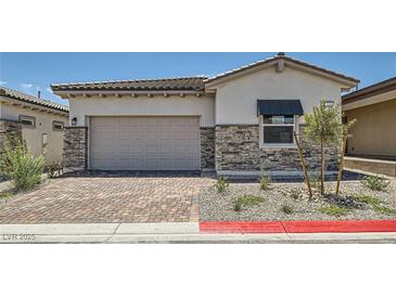 Charming single-story home with a two-car garage and beautiful stone accents at 105 Barkset Way, Henderson, NV 89011