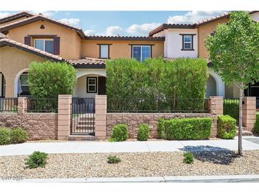Inviting two-story home with a well-maintained front yard and charming architectural details at 1922 Via Delle Arti, Henderson, NV 89044