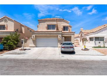 Charming two-story home with a well-maintained front yard and a spacious two-car garage, ideal for Gathering living at 309 Clifton Heights Dr, Las Vegas, NV 89145