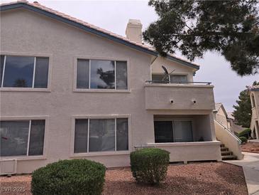 Two story home with a balcony, multiple windows, and low maintenance landscaping at 3425 E Russell Rd # 265, Las Vegas, NV 89120