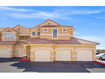 Beautiful condominium featuring a three-car garage, a tile roof, and a well maintained exterior at 5855 Valley Dr # 2130, North Las Vegas, NV 89031