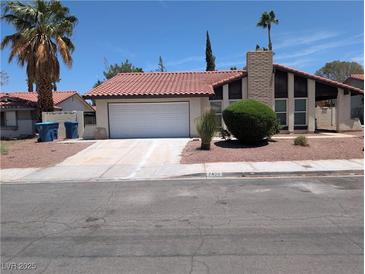 Charming single-story home with a red tile roof and a well-maintained front yard at 7426 Trudy Ln, Las Vegas, NV 89123