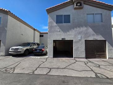 Multi-Gathering home features private garages, ample parking and a neutral color palette at 1739 N Lamont St, Las Vegas, NV 89115