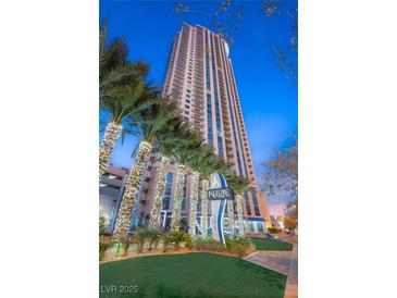 Striking full view of a high-rise building with the Allure sign and decorated palm trees at 200 W Sahara Ave # 2204, Las Vegas, NV 89102