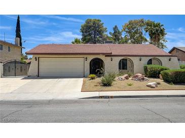 Charming single-story home featuring stucco siding, desert landscaping and an attached two-car garage at 3063 Chapala Dr, Las Vegas, NV 89120