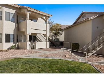 Inviting condo complex featuring well-maintained landscaping and neutral-toned buildings at 433 Mesa Blvd # 201, Mesquite, NV 89027