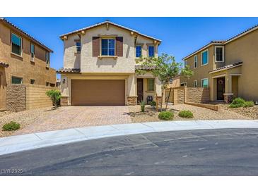 Charming two-story home with a two-car garage and a well-maintained front yard at 5606 Verde Valley Ct, North Las Vegas, NV 89081