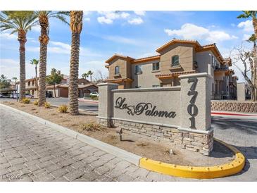 Beautiful community entrance with palm trees and desert landscaping, La Paloma at 7701 at 7701 W Robindale Rd # 274, Las Vegas, NV 89113