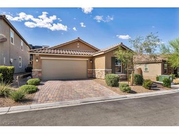 Charming single-story home with a two-car garage, paved driveway, and desert landscaping at 8346 Vinamala Ave, Las Vegas, NV 89149