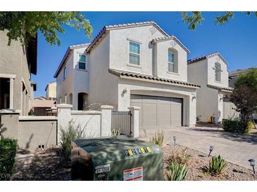 Charming two-story home with a two-car garage and a well-maintained, xeriscaped front yard at , Henderson, NV 89011