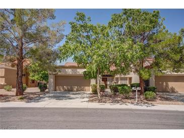 Charming single-story home with a two-car garage and mature trees in a well-maintained community at 2541 Desert Glen Dr, Las Vegas, NV 89134