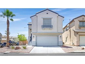 Two-story home with an attached garage and a well-maintained front yard at 3591 Gloucester Gate St, Las Vegas, NV 89122