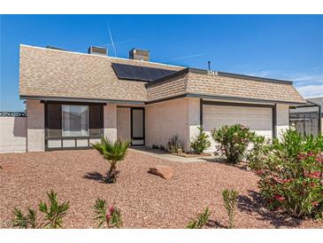 Charming single-story home featuring a gravel front yard, desert landscaping, and an attached two-car garage at 3748 Silent Hill Dr, Las Vegas, NV 89147