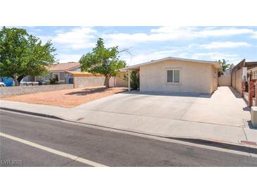 Cozy single-story home with a low-maintenance yard and a long driveway for convenient parking at 409 Antelope Way, Las Vegas, NV 89145
