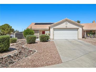 Charming single-story home featuring a well-manicured yard, two car garage, and desert landscaping at 5117 Axbridge Ct, North Las Vegas, NV 89031