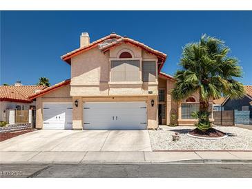 Charming two-story home featuring a stucco exterior, tile roof, and well-manicured landscaping at 6746 Shelter Ln, Las Vegas, NV 89103