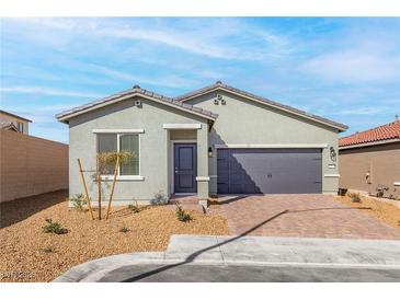 Charming single-story home featuring a two-car garage and desert landscaping at 2721 Avril Point St, Las Vegas, NV 89156