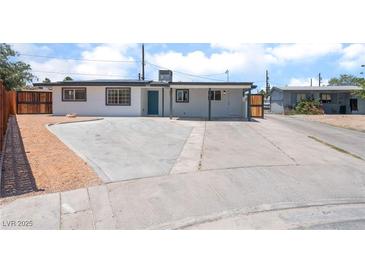 Charming single-story home featuring a spacious driveway and a neatly landscaped front yard at 1313 Purple Sage Ave, Las Vegas, NV 89108