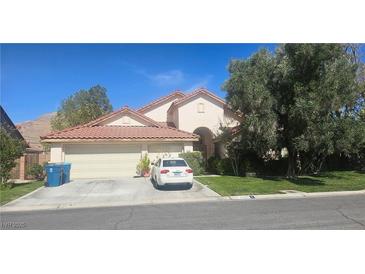 Charming single-Gathering home with a tile roof, two car garage and well-maintained landscaping at 1330 Honey Lake St, Las Vegas, NV 89110