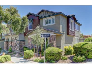 Charming home with a well-maintained yard, beautiful landscaping, and appealing exterior details at 1904 Via Firenze, Henderson, NV 89044