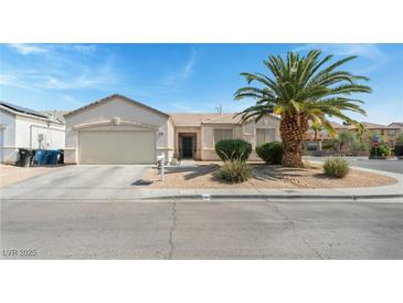 Charming single-story home with a two-car garage and desert landscaping at 3108 Sentimental Ct, North Las Vegas, NV 89031