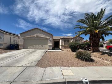 Charming single-story home featuring a low maintenance front yard, and a welcoming two-car garage at 3108 Sentimental Ct, North Las Vegas, NV 89031