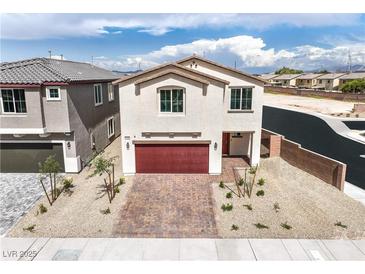 Inviting two-story home features a paver driveway, low maintenance landscaping, and a two-car garage at 1301 Miller Springs Ln # Lot 93, North Las Vegas, NV 89084