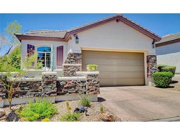 Charming single story home with stone accents and well-maintained landscaping at 169 Pioneer Peak Pl, Las Vegas, NV 89138