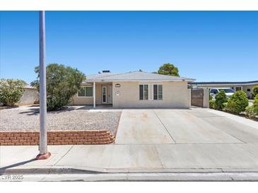 Charming single-story home with a well-maintained front yard and long driveway at 321 Oil Lantern Ln, Las Vegas, NV 89145
