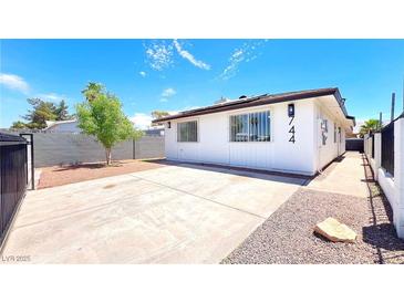 Charming single story home featuring a spacious driveway and well-maintained yard at 744 Hubbard St, Las Vegas, NV 89110