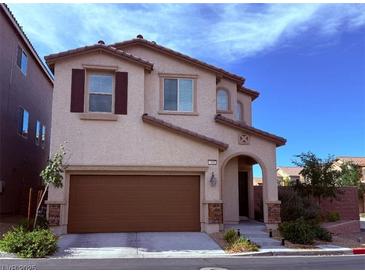 Charming two-story home with a two-car garage and well-maintained landscaping at 7468 Wellfleet Bay Ave, Las Vegas, NV 89179