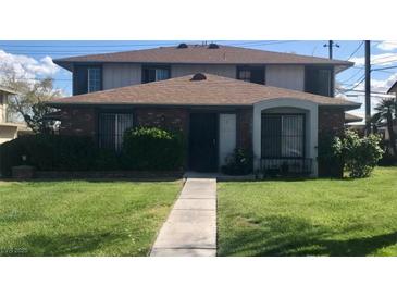 Charming condo featuring a well-maintained lawn and unique architectural elements at , Las Vegas, NV 89119