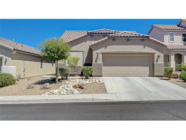 Charming single-story home with a well-maintained front yard and a two-car garage at 1076 Crescent Falls St, Henderson, NV 89011
