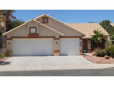 Charming single-story home featuring a two-car garage and well-maintained desert landscaping at 241 Honeywood St, Henderson, NV 89074
