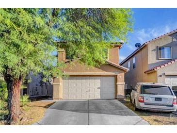 Charming two-story home with a two-car garage and well-maintained landscaping at 4215 Macadamia Dr, Las Vegas, NV 89115
