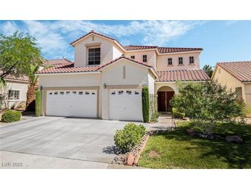 Charming two-story home with a well-manicured lawn and three-car garage at 532 Kavanagh Pl, Las Vegas, NV 89123