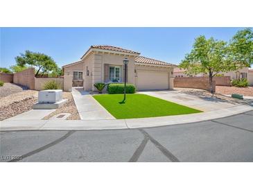 Charming single-story home with well-maintained landscaping and a welcoming entrance on a sunny day at 7816 Glowing Peak St, Las Vegas, NV 89131