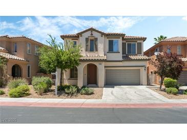 Charming two-story home with a well-maintained front yard, two-car garage, and traditional Southwest architecture at 11900 Calle De Sol Dr, Las Vegas, NV 89138